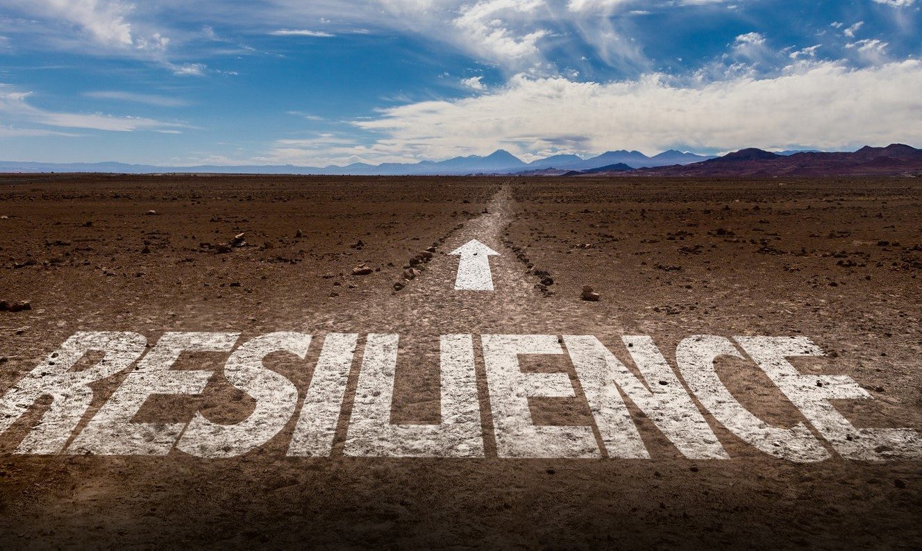 Resilience written on desert road