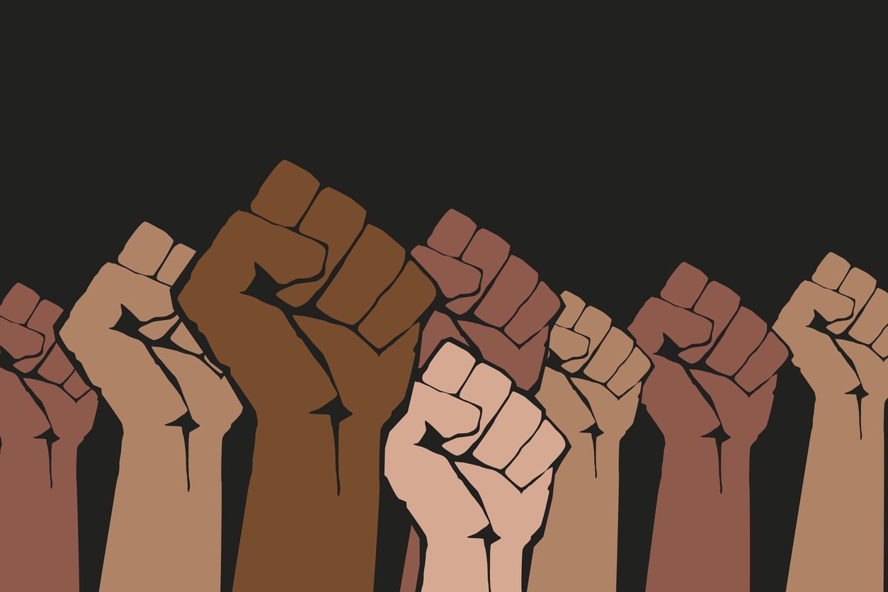 diverse fists to declare racism a public health crisis