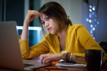 latino teen student distance learning laptop computer home coronavirus worry stress