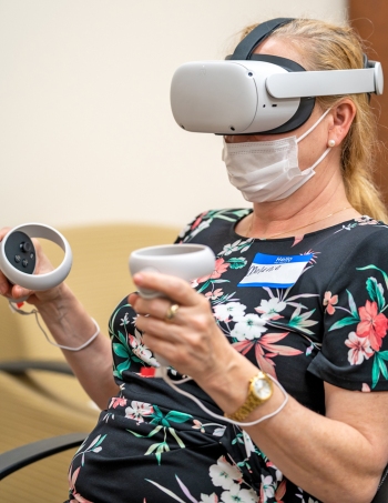 A VA employee participates in a VR training program.