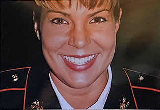 Female Veteran in Marine Corps dress uniform